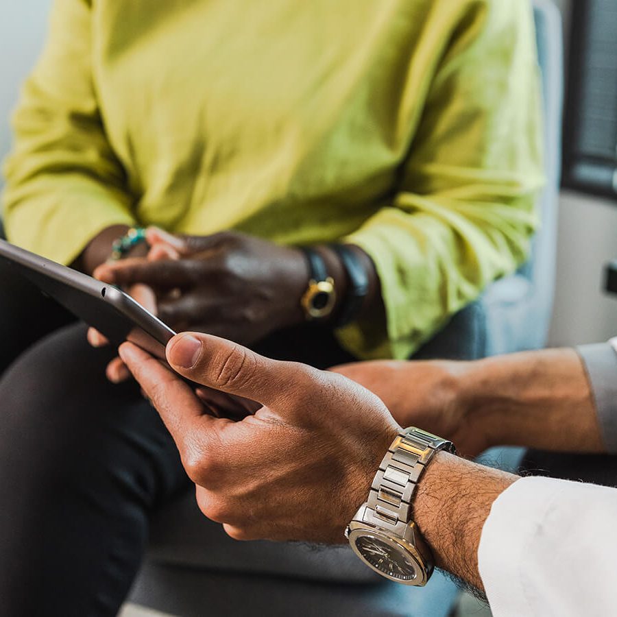 Doctor showing patient Heru test results